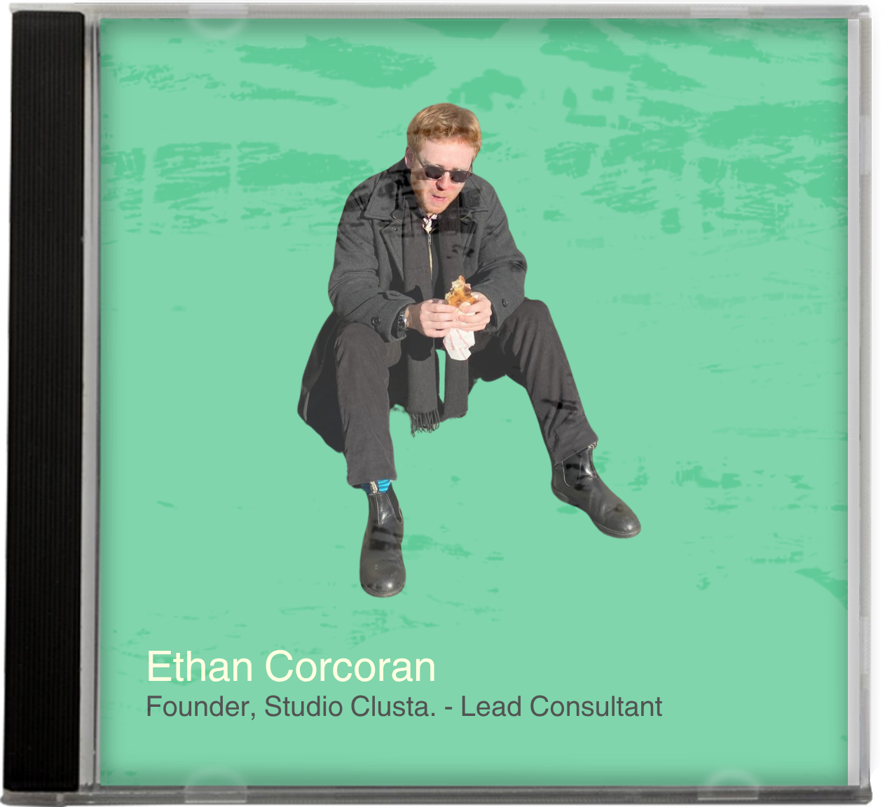 Image of CD cover with title Ethan Corcoran, Founder, Studio Clusta. - lead consultant. Cover art is Ethan eating a sandwich on a green background.